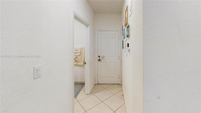 22986 SW 128th Pl, Miami, FL 33170 - hallway featuring light tile patterned floors and a textured wall