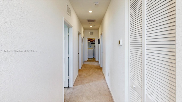 22986 SW 128th Pl, Miami, FL 33170 - hallway with light colored carpet, washer / dryer, recessed lighting, and baseboards