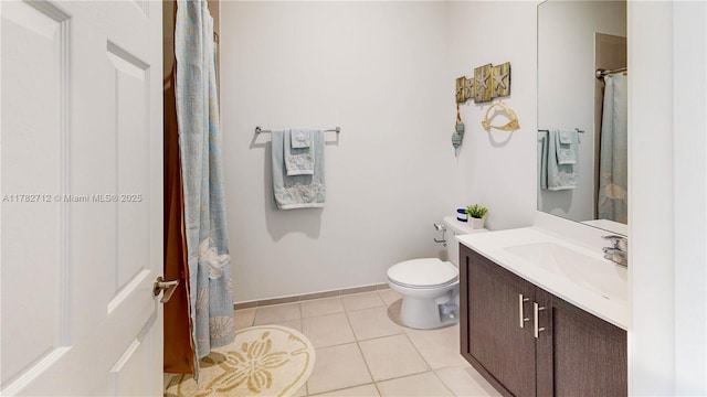 22986 SW 128th Pl, Miami, FL 33170 - full bathroom with tile patterned floors, toilet, vanity, baseboards, and curtained shower