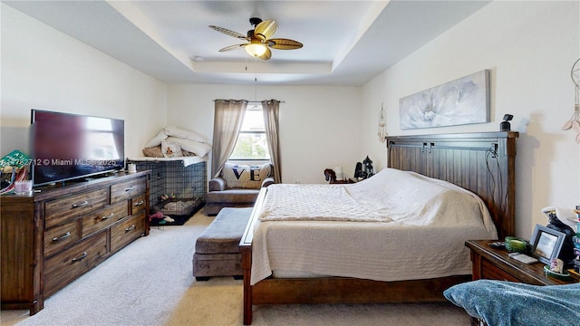 22986 SW 128th Pl, Miami, FL 33170 - bedroom with light colored carpet, a tray ceiling, and ceiling fan