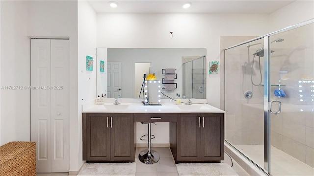 22986 SW 128th Pl, Miami, FL 33170 - full bath featuring a closet, a stall shower, tile patterned floors, and double vanity