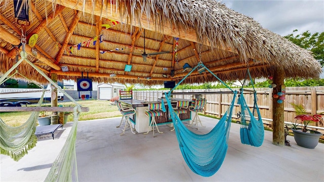 22986 SW 128th Pl, Miami, FL 33170 - view of patio featuring a gazebo, a storage shed, fence, and an outdoor structure