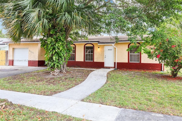 8101 NW 44th Ct, Lauderhill, FL 33351 - single story home with stucco siding, brick siding, a front lawn, and asphalt driveway