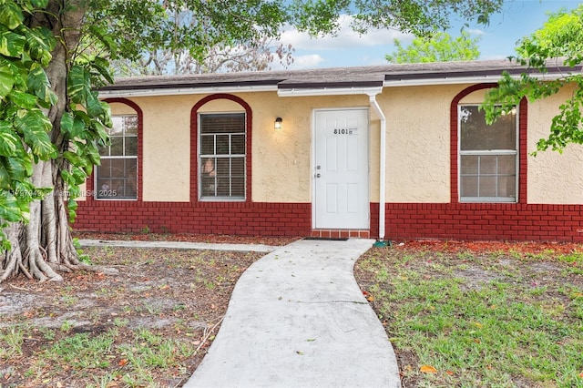 8101 NW 44th Ct, Lauderhill, FL 33351 - view of front of home featuring stucco siding and brick siding