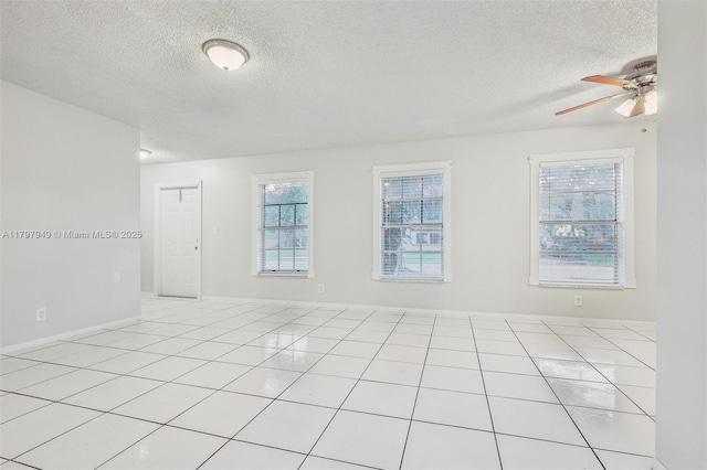 8101 NW 44th Ct, Lauderhill, FL 33351 - spare room with a textured ceiling, plenty of natural light, ceiling fan, and light tile patterned floors
