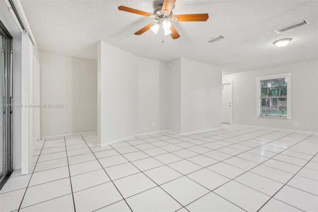 8101 NW 44th Ct, Lauderhill, FL 33351 - empty room featuring a textured ceiling, light tile patterned floors, and ceiling fan