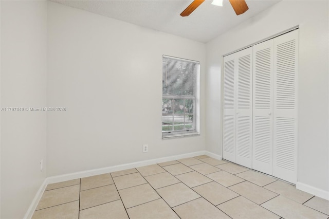 8101 NW 44th Ct, Lauderhill, FL 33351 - unfurnished bedroom featuring a closet, light tile patterned flooring, and ceiling fan