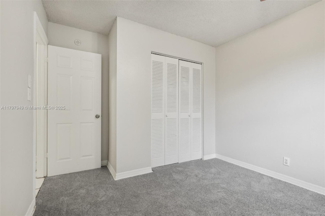 8101 NW 44th Ct, Lauderhill, FL 33351 - unfurnished bedroom featuring carpet, a textured ceiling, and a closet