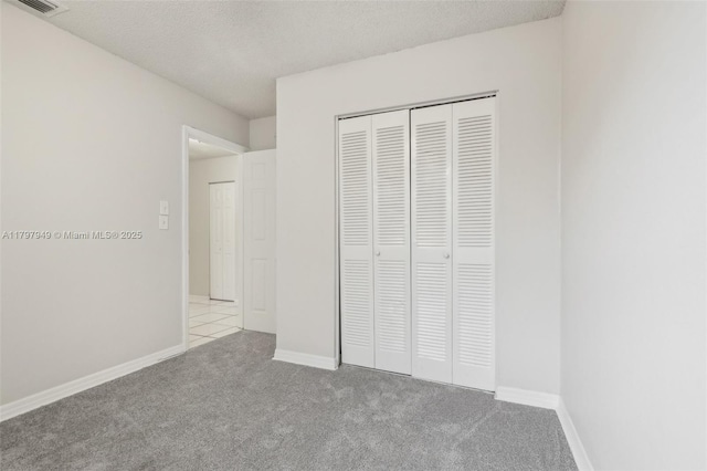 8101 NW 44th Ct, Lauderhill, FL 33351 - unfurnished bedroom featuring carpet flooring, a closet, and a textured ceiling