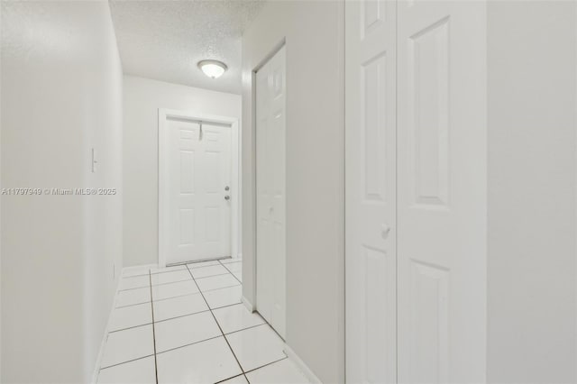 8101 NW 44th Ct, Lauderhill, FL 33351 - hall with a textured ceiling and light tile patterned floors
