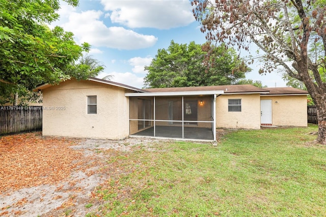 8101 NW 44th Ct, Lauderhill, FL 33351 - back of property featuring a sunroom and stucco siding