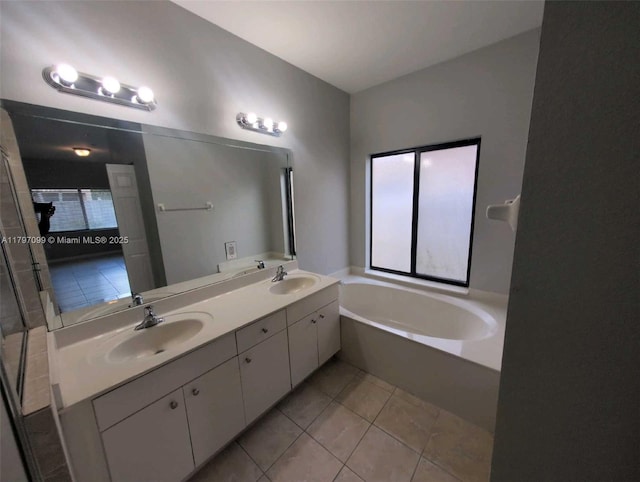 22664 SW 109th Path, Miami, FL 33170 - bathroom with tile patterned floors, double vanity, and a bath