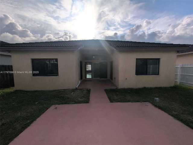 22664 SW 109th Path, Miami, FL 33170 - back of house with a patio, stucco siding, a tiled roof, and fence