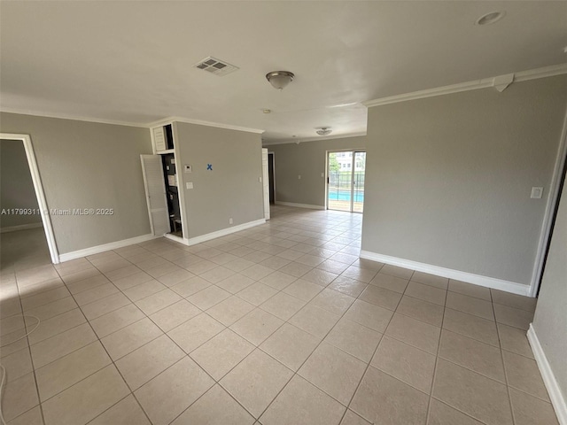 4920 NW 11th St, Lauderhill, FL 33313 - spare room featuring light tile patterned flooring, ornamental molding, and baseboards