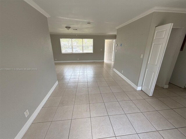 4920 NW 11th St, Lauderhill, FL 33313 - empty room with crown molding, light tile patterned floors, and baseboards