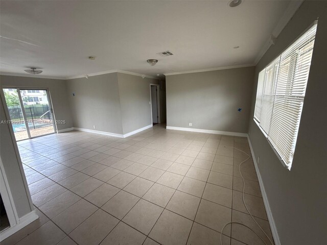 4920 NW 11th St, Lauderhill, FL 33313 - unfurnished room with light tile patterned floors, crown molding, and baseboards