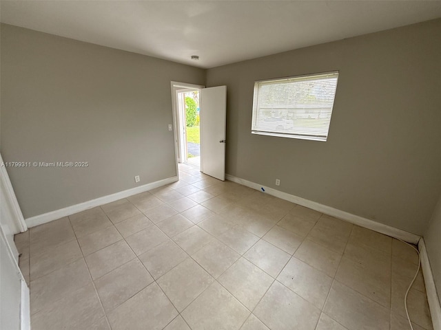 4920 NW 11th St, Lauderhill, FL 33313 - spare room featuring light tile patterned floors and baseboards