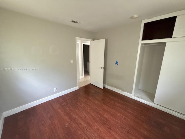 4920 NW 11th St, Lauderhill, FL 33313 - unfurnished bedroom featuring wood finished floors, a closet, and baseboards