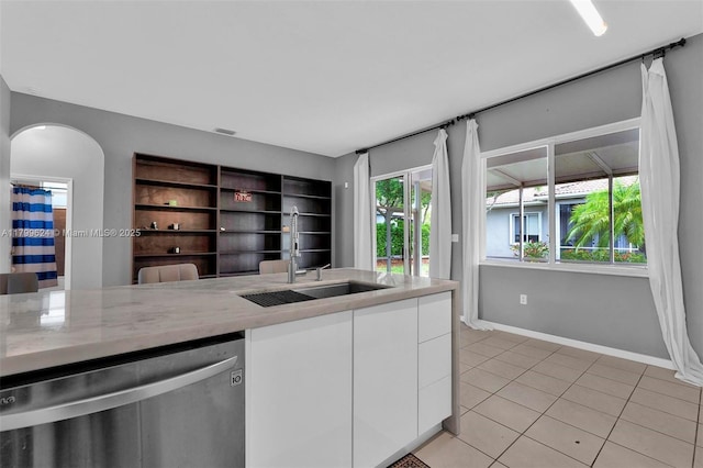 2625 SE 5th Ct, Homestead, FL 33033 - kitchen featuring dishwasher, a sink, white cabinets, light tile patterned flooring, and baseboards