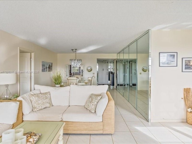 living room featuring light tile patterned floors and a chandelier