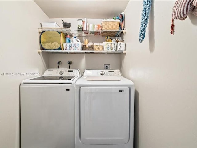 laundry area with separate washer and dryer
