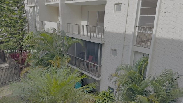 view of building exterior featuring fence