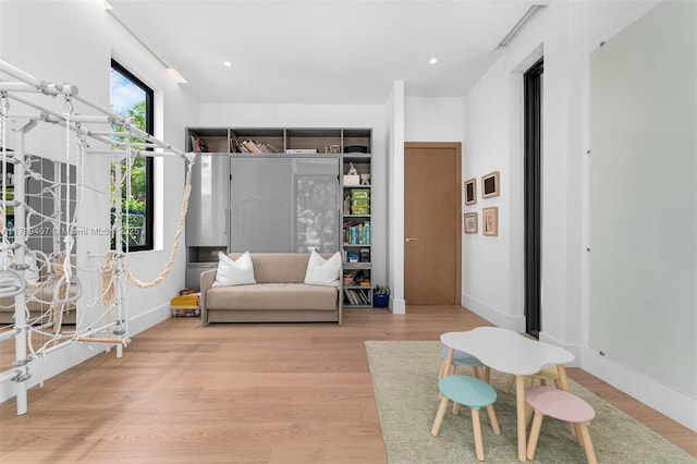 living area featuring wood finished floors and baseboards