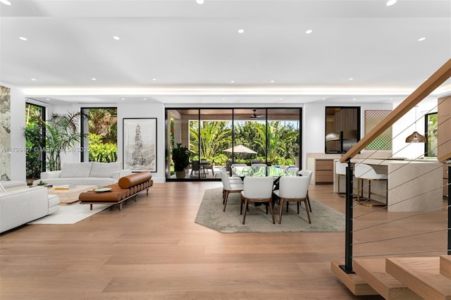 living room with recessed lighting, plenty of natural light, and light wood-style floors