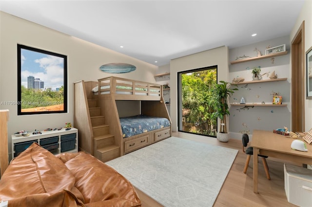 bedroom featuring wood finished floors and recessed lighting