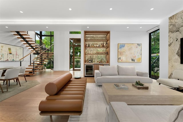building lobby with stairway, recessed lighting, and floor to ceiling windows