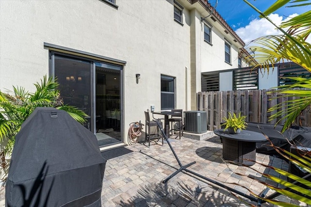 25079 SW 114th Ct, Homestead, FL 33032 - view of patio with a grill, central AC unit, and fence