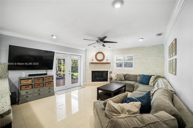 17514 SW 82nd Ct, Palmetto Bay, FL 33157 - tiled living area featuring ornamental molding, a ceiling fan, plenty of natural light, a fireplace, and recessed lighting