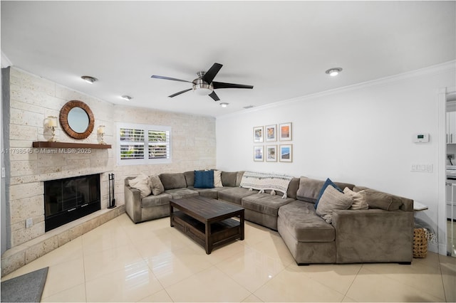 17514 SW 82nd Ct, Palmetto Bay, FL 33157 - living room with ceiling fan, crown molding, a stone fireplace, tile patterned flooring, and recessed lighting