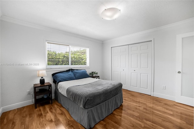 17514 SW 82nd Ct, Palmetto Bay, FL 33157 - bedroom with crown molding, a closet, and wood finished floors