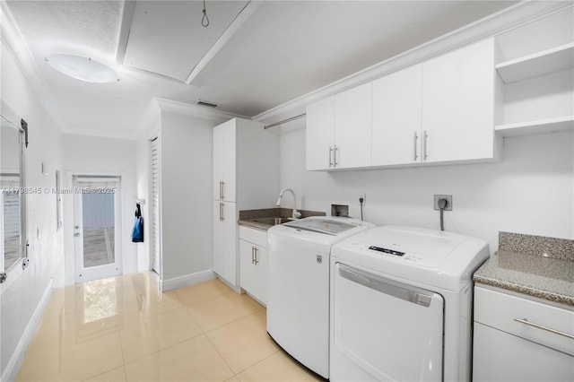 17514 SW 82nd Ct, Palmetto Bay, FL 33157 - laundry room with cabinet space, washer and clothes dryer, light tile patterned floors, and crown molding