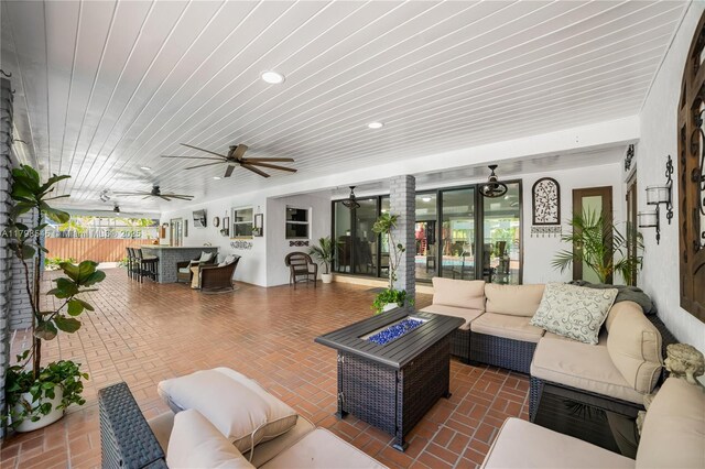 17514 SW 82nd Ct, Palmetto Bay, FL 33157 - view of patio / terrace with an outdoor living space with a fire pit and a ceiling fan