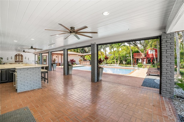 17514 SW 82nd Ct, Palmetto Bay, FL 33157 - view of patio / terrace with a ceiling fan and an outdoor pool