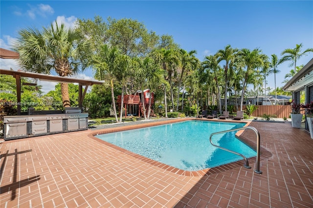 17514 SW 82nd Ct, Palmetto Bay, FL 33157 - outdoor pool with area for grilling and a patio