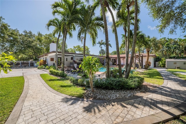 17514 SW 82nd Ct, Palmetto Bay, FL 33157 - view of front of home with a chimney, stucco siding, and a swimming pool