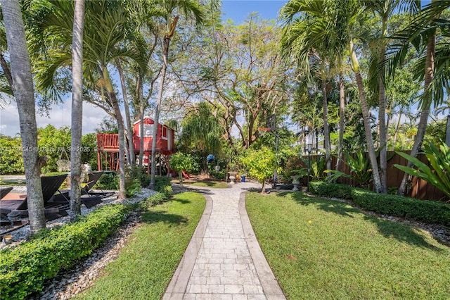 view of home's community with a yard