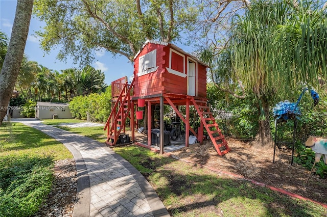 17514 SW 82nd Ct, Palmetto Bay, FL 33157 - view of jungle gym with a lawn