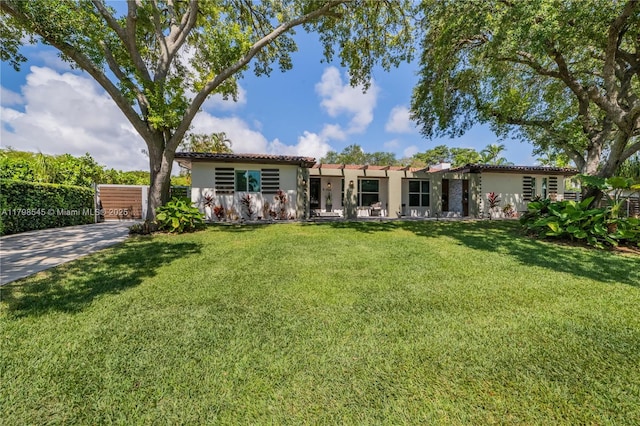 17514 SW 82nd Ct, Palmetto Bay, FL 33157 - view of front of home featuring stucco siding, a front yard, and a tiled roof