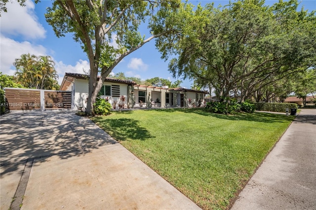 17514 SW 82nd Ct, Palmetto Bay, FL 33157 - mediterranean / spanish-style home with stucco siding, concrete driveway, and a tile roof