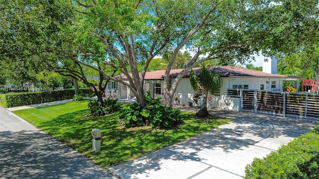 view of front of house featuring a chimney and stucco siding