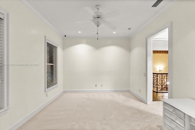 12 Tidewater Dr, Ormond Beach, FL 32174 - empty room featuring ornamental molding, light colored carpet, a ceiling fan, baseboards, and a pendent fire sprinkler