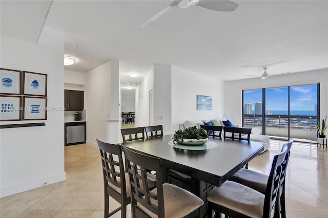 3400 NE 192nd St Unit Ph11, Aventura, FL 33180 - dining room with ceiling fan, light tile patterned flooring, and baseboards