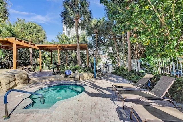 3400 NE 192nd St Unit Ph11, Aventura, FL 33180 - view of swimming pool with fence, a patio, a community hot tub, and a pergola