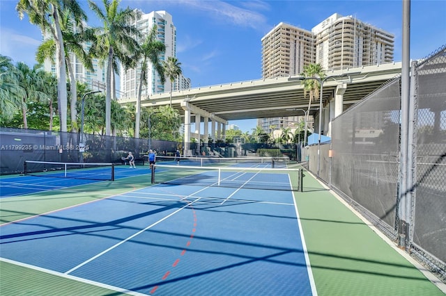3400 NE 192nd St Unit Ph11, Aventura, FL 33180 - view of tennis court with fence and community basketball court