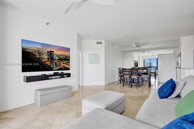 3400 NE 192nd St Unit Ph11, Aventura, FL 33180 - living room featuring a ceiling fan, baseboards, and light tile patterned floors
