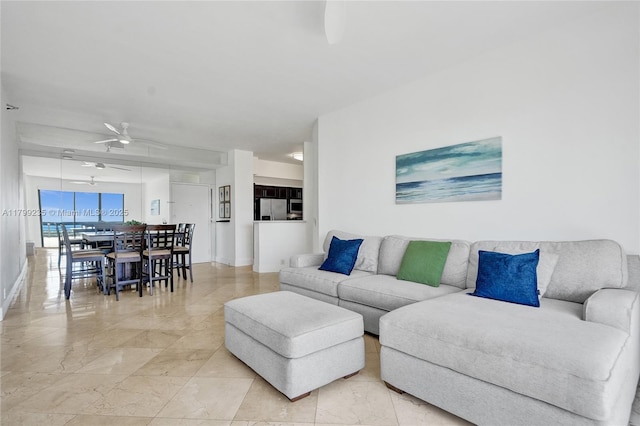 3400 NE 192nd St Unit Ph11, Aventura, FL 33180 - living area with ceiling fan, light marble finish floors, and baseboards